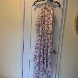 The most beautiful cut and pattern Keepsake dress. Flowy skirt, cutout back